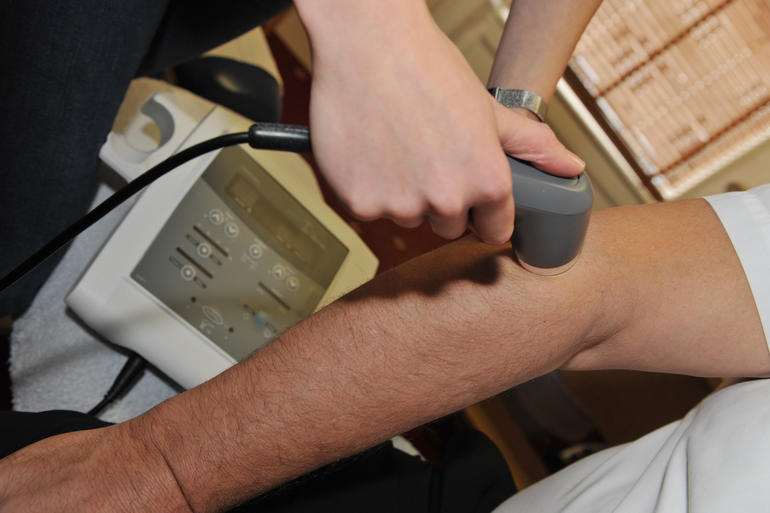 Ultrasound chiropractic therapy assisting elbow pain